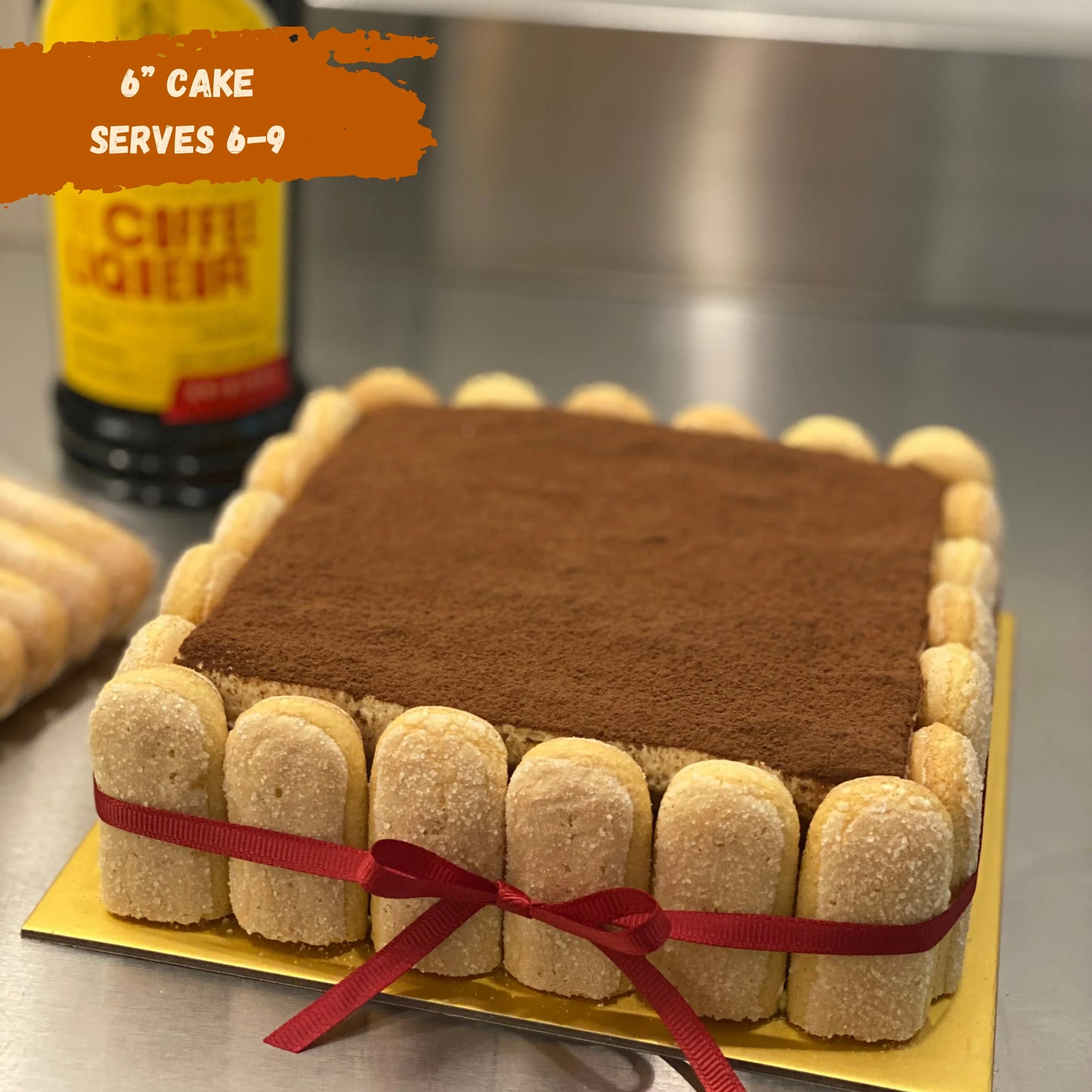 Classic tiramisu 6 inch cake dusted with cocoa powder wrapped with a ribbon – handcrafted in Singapore