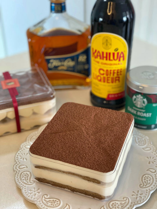 Classic tiramisu dessert served with coffee beans and cocoa powder – artisanal treat from Singapore