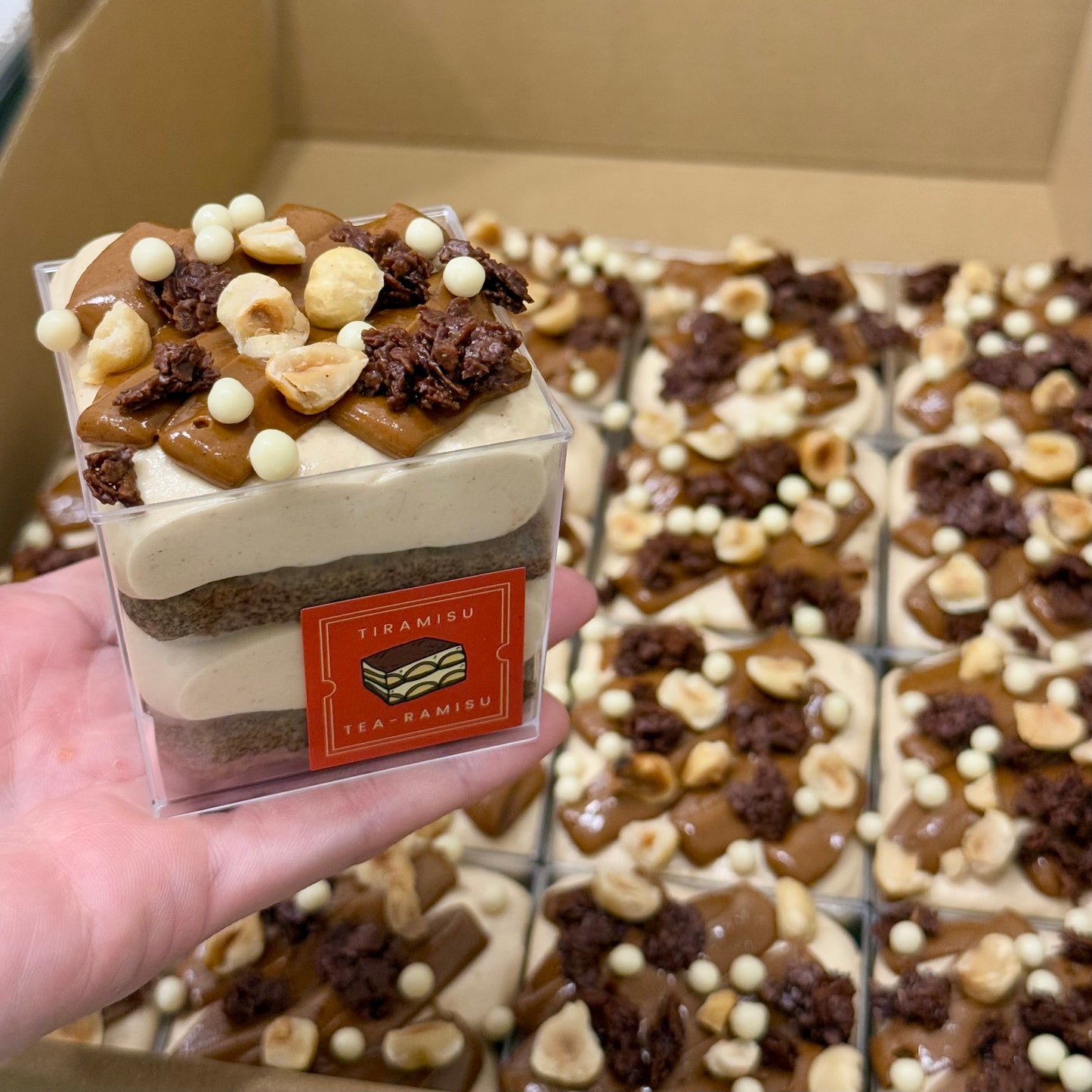 Set of 16 single serving cups of tiramisu with hazelnut toppings