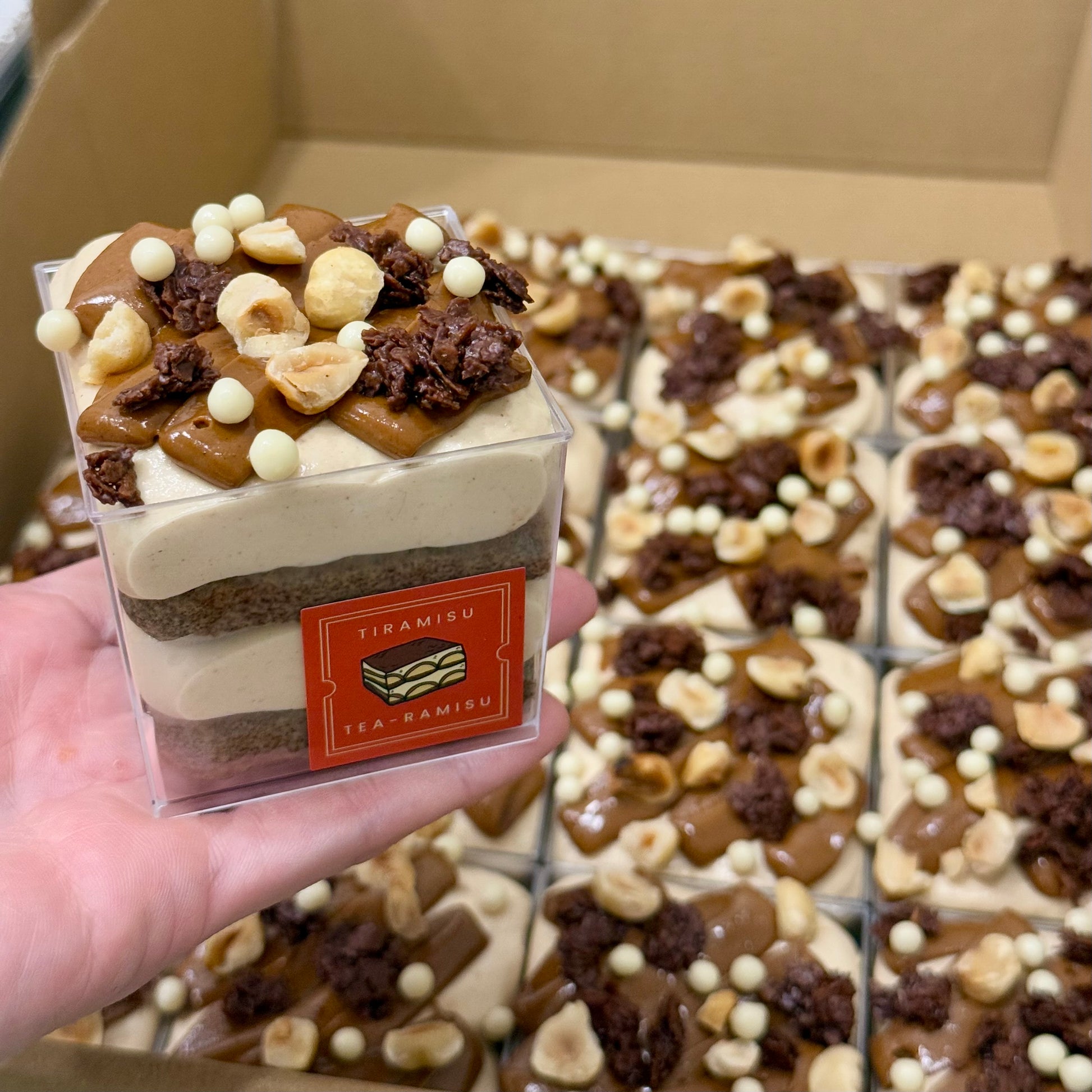 Set of 16 single serving cups of tiramisu with hazelnut toppings